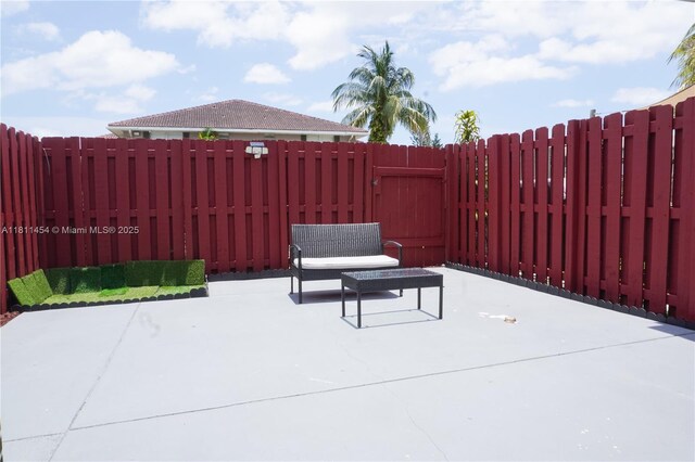 721 NW 105th Ter Unit 721, Pembroke Pines, FL 33026 - fenced backyard with a patio area and a gate