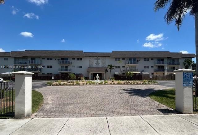 8475 SW 94th St Unit 116E, Miami, FL 33156 - view of building exterior featuring a residential view and decorative driveway