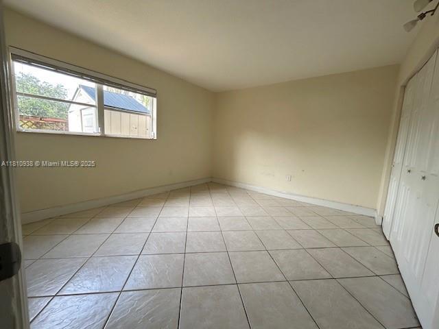 8475 SW 94th St Unit 116E, Miami, FL 33156 - unfurnished room with light tile patterned floors and baseboards