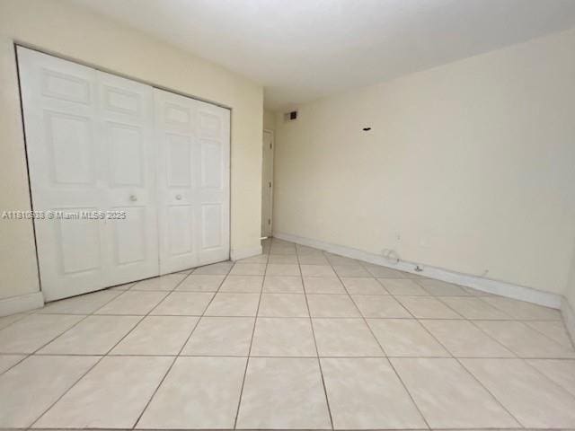 8475 SW 94th St Unit 116E, Miami, FL 33156 - unfurnished bedroom with a closet and baseboards