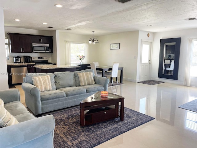 4752 SW 127th Ct, Miami, FL 33175 - living area featuring a chandelier and recessed lighting