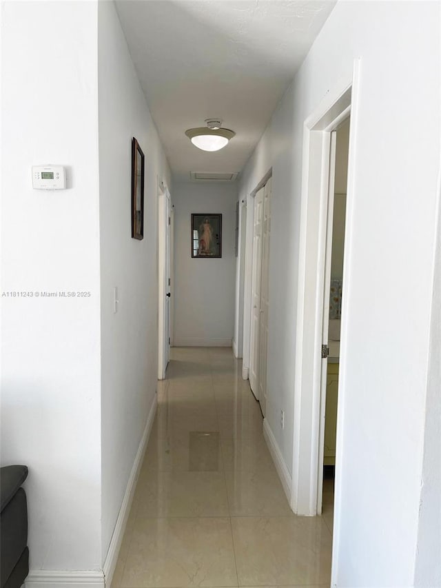 4752 SW 127th Ct, Miami, FL 33175 - hallway featuring baseboards and light tile patterned flooring