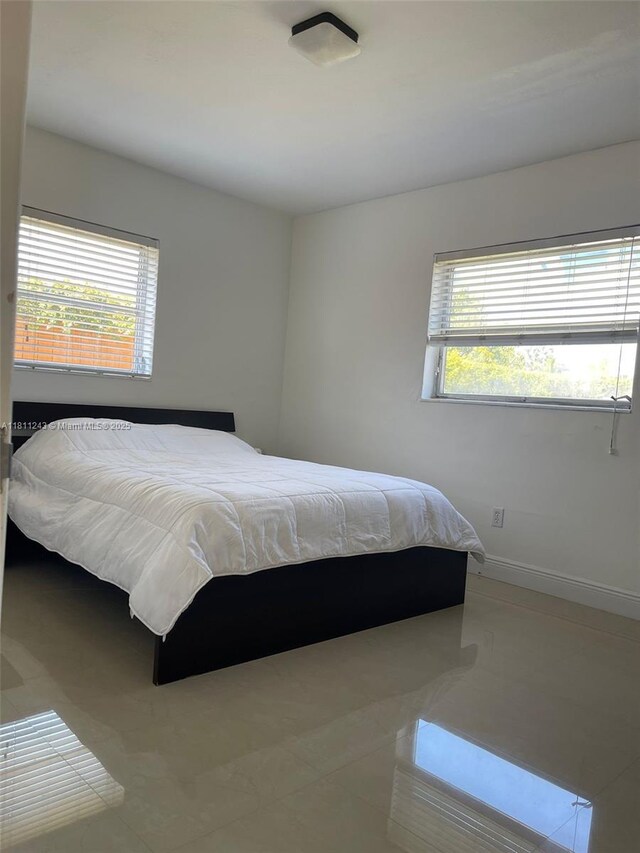4752 SW 127th Ct, Miami, FL 33175 - bedroom with multiple windows and tile patterned floors