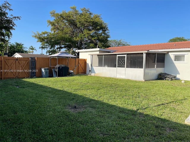 4752 SW 127th Ct, Miami, FL 33175 - view of yard featuring a sunroom and a gate