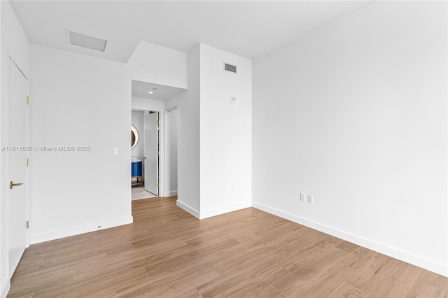 2678 Tigertail Ave Unit 513, Coconut Grove, FL 33133 - spare room with light wood-type flooring and baseboards