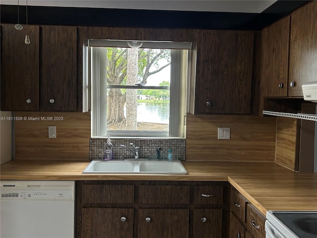 322 Briarwood Cir Unit 1-17, Hollywood, FL 33024 - kitchen with white appliances, a sink, decorative backsplash, light countertops, and dark brown cabinetry