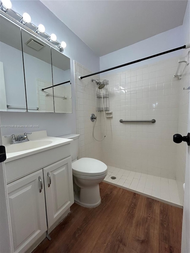 322 Briarwood Cir Unit 1-17, Hollywood, FL 33024 - full bath with toilet, a tile shower, and wood finished floors