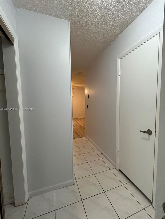 322 Briarwood Cir Unit 1-17, Hollywood, FL 33024 - hall featuring a textured ceiling