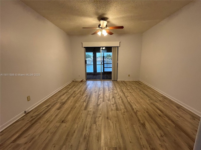 322 Briarwood Cir Unit 1-17, Hollywood, FL 33024 - empty room with wood finished floors, ceiling fan, a textured ceiling, and baseboards