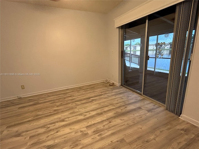 322 Briarwood Cir Unit 1-17, Hollywood, FL 33024 - spare room with baseboards and wood finished floors