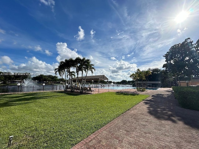 322 Briarwood Cir Unit 1-17, Hollywood, FL 33024 - view of yard featuring a community pool and a water view