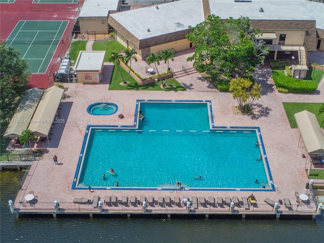 322 Briarwood Cir Unit 1-17, Hollywood, FL 33024 - view of subject property featuring a pool and a nearby body of water