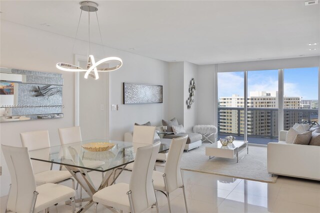 1800 S Ocean Dr Unit 1708, Hallandale Beach, FL 33009 - dining space with light tile patterned flooring, a chandelier, and a city view