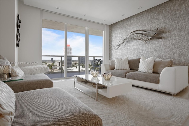 1800 S Ocean Dr Unit 1708, Hallandale Beach, FL 33009 - living room featuring floor to ceiling windows, wallpapered walls, and a water view