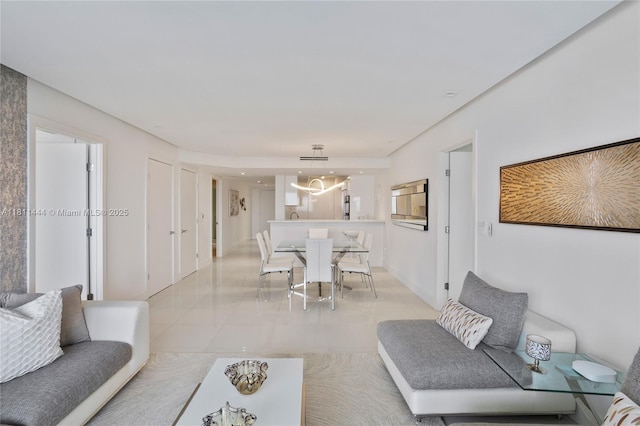 1800 S Ocean Dr Unit 1708, Hallandale Beach, FL 33009 - living area with light tile patterned floors and a chandelier