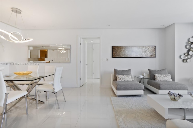1800 S Ocean Dr Unit 1708, Hallandale Beach, FL 33009 - tiled living room featuring a chandelier and baseboards