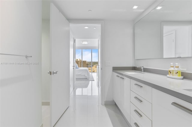 1800 S Ocean Dr Unit 1708, Hallandale Beach, FL 33009 - ensuite bathroom featuring double vanity, tile patterned floors, and baseboards