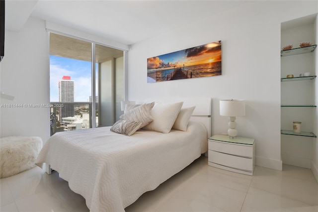 1800 S Ocean Dr Unit 1708, Hallandale Beach, FL 33009 - tiled bedroom with a wall of windows, a city view, and baseboards