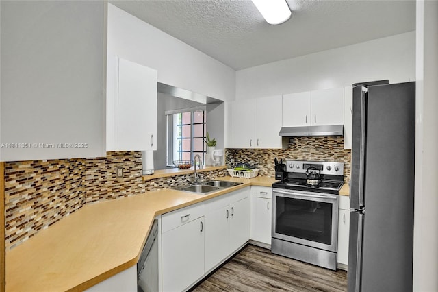 1001 NW 100th Ave, Pembroke Pines, FL 33024 - kitchen with stainless steel appliances, a sink, dark wood-type flooring, light countertops, and white cabinets