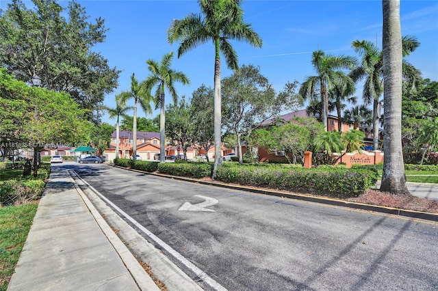 1001 NW 100th Ave, Pembroke Pines, FL 33024 - view of asphalt street with curbs, a residential view, and sidewalks