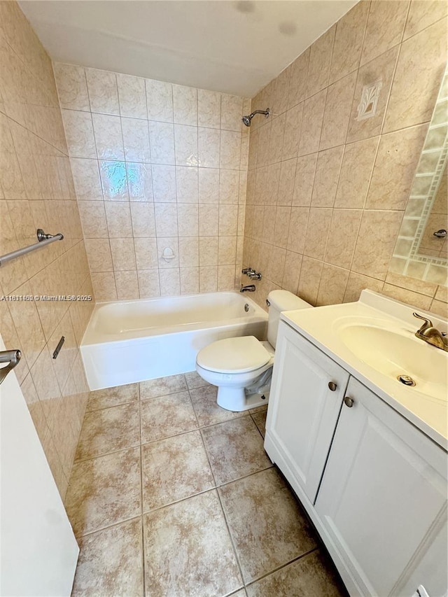 3660 NE 166th St Unit 603, North Miami Beach, FL 33160 - full bath with tile walls, vanity, toilet, tile patterned flooring, and washtub / shower combination