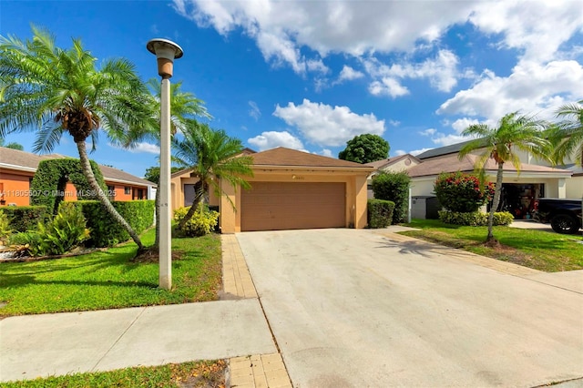3831 NW 21st St, Coconut Creek, FL 33066 - view of front of property with stucco siding, a front yard, an attached garage, and driveway