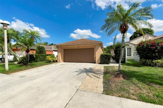 3831 NW 21st St, Coconut Creek, FL 33066 - view of front of property featuring stucco siding, a front lawn, driveway, and a garage