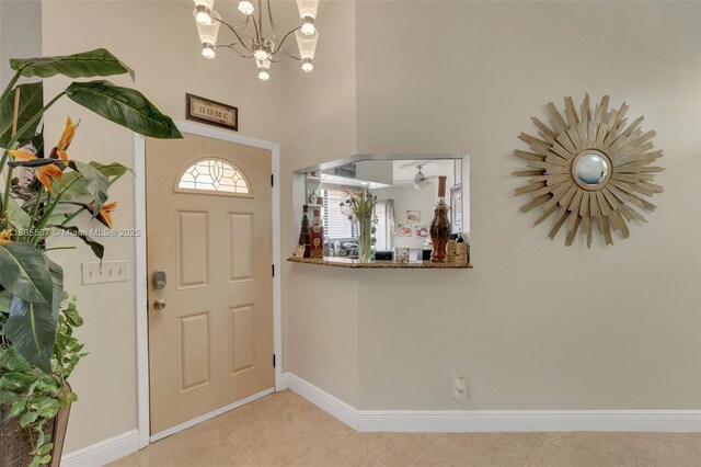 3831 NW 21st St, Coconut Creek, FL 33066 - entrance foyer featuring a chandelier, baseboards, and light tile patterned floors