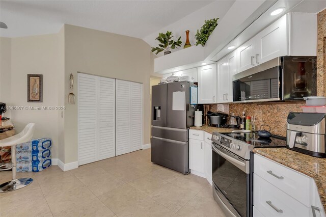 3831 NW 21st St, Coconut Creek, FL 33066 - kitchen with appliances with stainless steel finishes, tasteful backsplash, white cabinets, light tile patterned flooring, and light stone counters