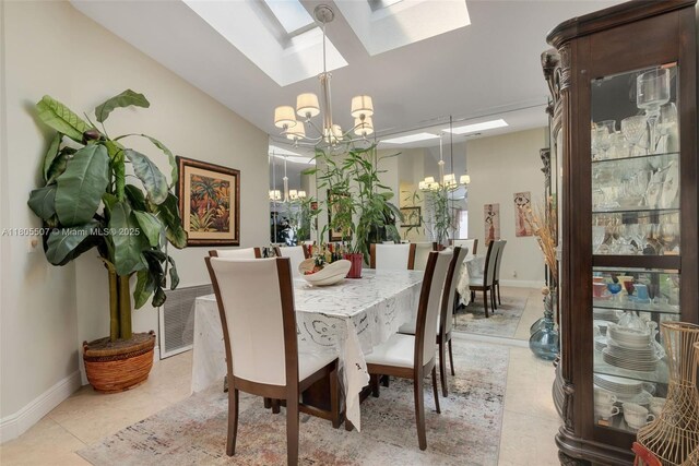 3831 NW 21st St, Coconut Creek, FL 33066 - dining area with a chandelier, a skylight, light tile patterned floors, and baseboards