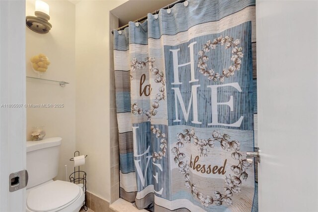 3831 NW 21st St, Coconut Creek, FL 33066 - bathroom featuring toilet and a shower with curtain