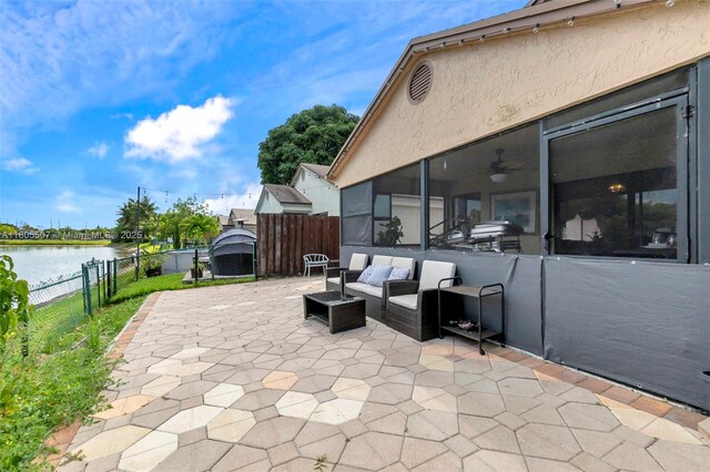 3831 NW 21st St, Coconut Creek, FL 33066 - view of patio / terrace featuring a water view, a sunroom, and an outdoor living space