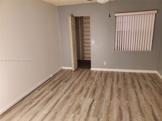800 SW 131st Ave Unit 113F, Pembroke Pines, FL 33027 - empty room featuring wood finished floors and baseboards