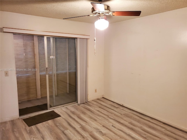 800 SW 131st Ave Unit 113F, Pembroke Pines, FL 33027 - unfurnished bedroom with wood finished floors, a closet, a ceiling fan, baseboards, and a textured ceiling