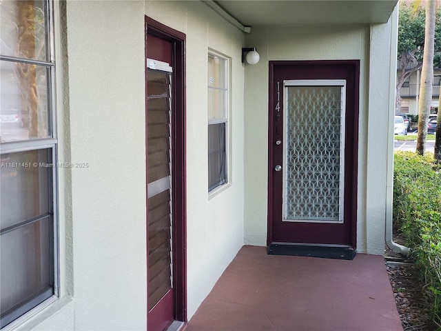 800 SW 131st Ave Unit 113F, Pembroke Pines, FL 33027 - doorway to property featuring stucco siding