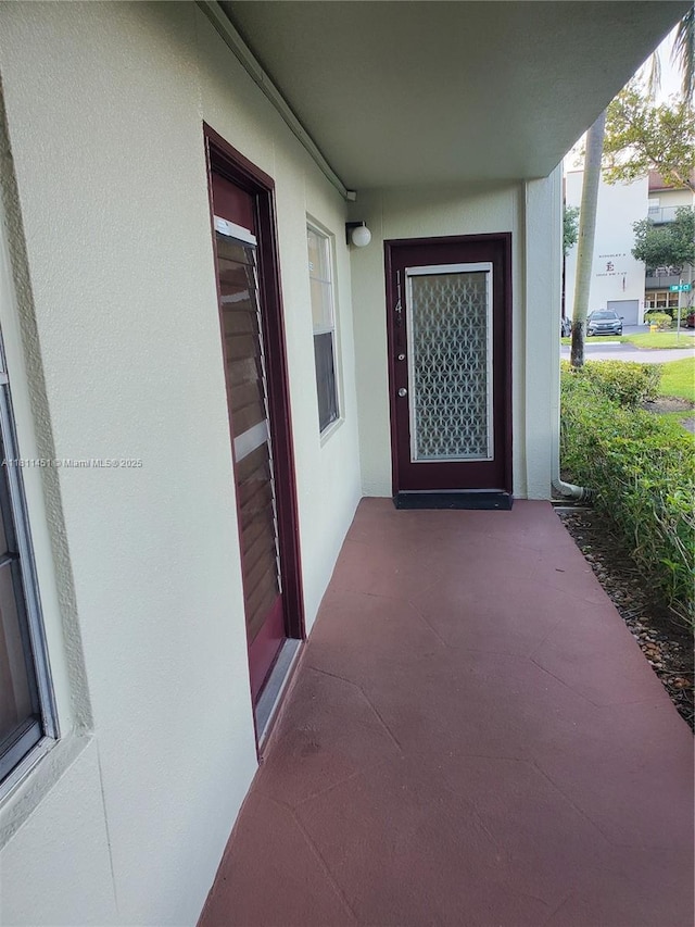800 SW 131st Ave Unit 113F, Pembroke Pines, FL 33027 - doorway to property featuring stucco siding
