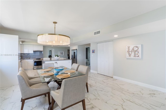 812 N Ocean Blvd Unit 405, Pompano Beach, FL 33062 - dining room with light marble finish flooring, baseboards, and recessed lighting