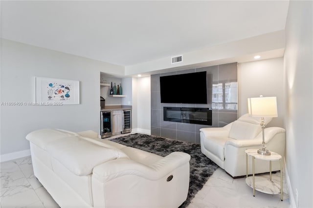 812 N Ocean Blvd Unit 405, Pompano Beach, FL 33062 - living room featuring marble look tiles, beverage cooler, baseboards, bar, and recessed lighting