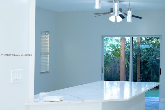 1371 NE 42nd Ave, Homestead, FL 33033 - interior space featuring ceiling fan and light stone countertops
