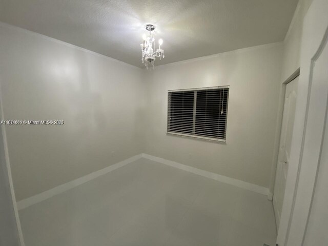 1371 NE 42nd Ave, Homestead, FL 33033 - empty room featuring a chandelier and baseboards