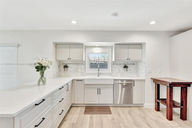 651 E Lake Dasha Dr, Plantation, FL 33324 - kitchen with dishwasher, a sink, tasteful backsplash, light wood-style floors, and recessed lighting