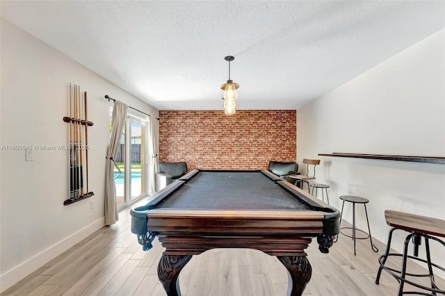 651 E Lake Dasha Dr, Plantation, FL 33324 - recreation room featuring brick wall, baseboards, billiards, light wood finished floors, and a textured ceiling