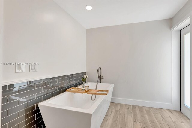651 E Lake Dasha Dr, Plantation, FL 33324 - full bath featuring tile walls, a soaking tub, wood finished floors, recessed lighting, and a wainscoted wall