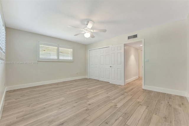 651 E Lake Dasha Dr, Plantation, FL 33324 - unfurnished bedroom featuring light wood finished floors, baseboards, a closet, and a ceiling fan