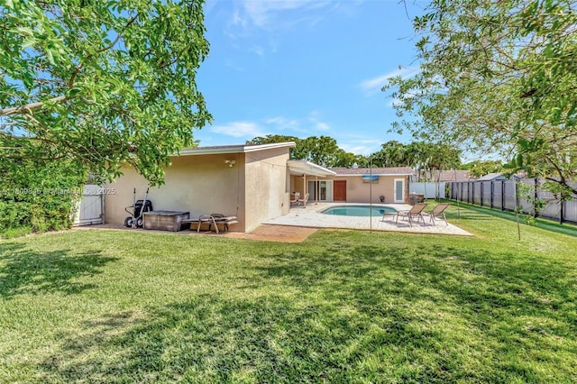 651 E Lake Dasha Dr, Plantation, FL 33324 - rear view of property featuring stucco siding and a patio