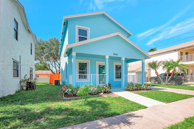 5565 SW 43rd St, Davie, FL 33314 - view of front of property with a porch, stucco siding, and cooling unit