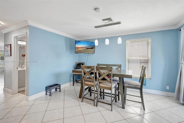 5565 SW 43rd St, Davie, FL 33314 - dining area featuring ornamental molding, baseboards, and light tile patterned floors
