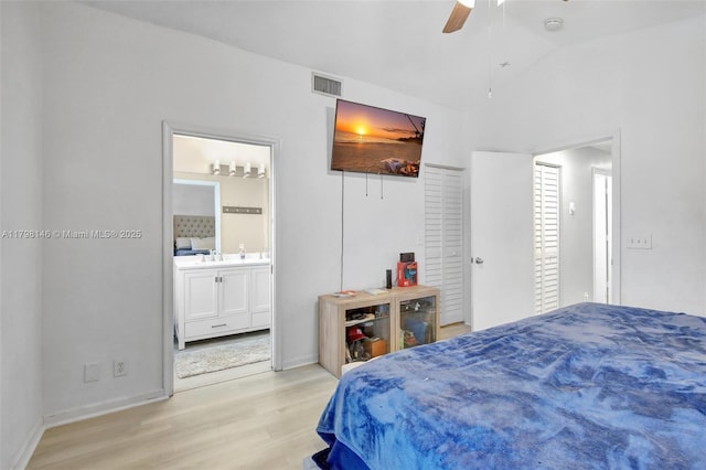 5565 SW 43rd St, Davie, FL 33314 - bedroom with light wood-type flooring, baseboards, lofted ceiling, ensuite bath, and ceiling fan