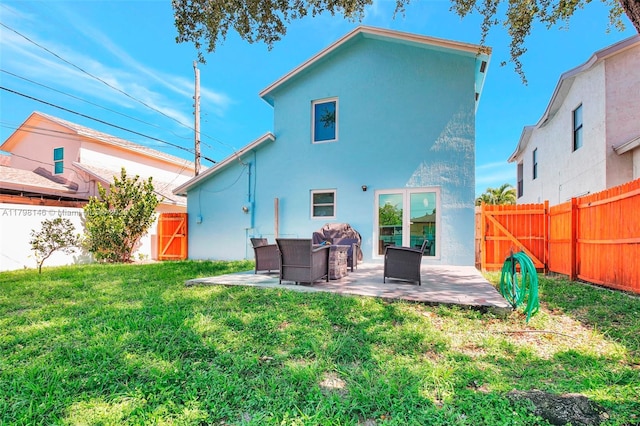 5565 SW 43rd St, Davie, FL 33314 - back of property featuring a patio area, stucco siding, and outdoor lounge area
