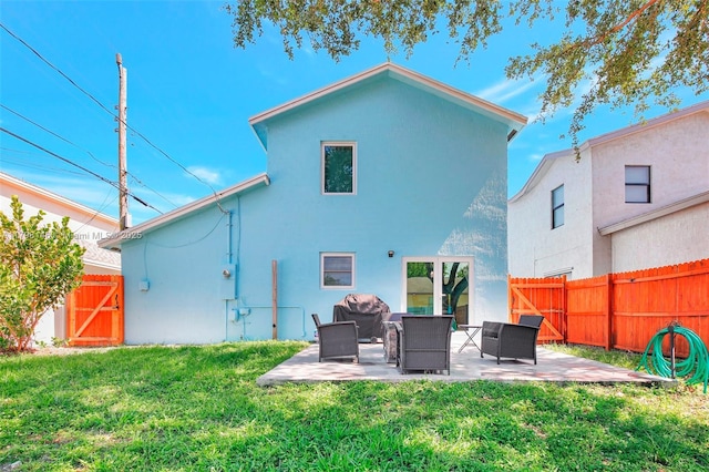 5565 SW 43rd St, Davie, FL 33314 - rear view of property featuring a patio, stucco siding, and an outdoor living space